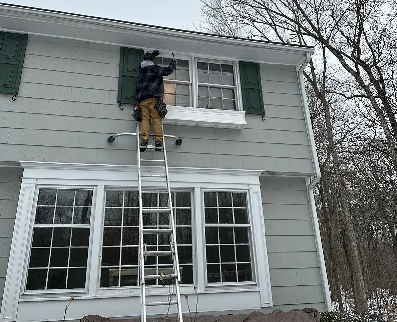 Beginning to remove the old double hung windows
